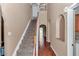Bright foyer with staircase, archways and hardwood floors create an inviting entrance at 4602 Se 28Th St, Ocala, FL 34480