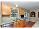 This kitchen has stainless appliances, granite countertops, and a double sink beneath a sunny window at 4602 Se 28Th St, Ocala, FL 34480