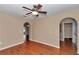 Cozy living room featuring sleek wood floors, a ceiling fan, and an open layout for easy entertaining at 4602 Se 28Th St, Ocala, FL 34480
