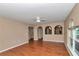 Spacious living room with tile floors and views into the kitchen and hallway at 4602 Se 28Th St, Ocala, FL 34480