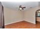 Inviting living room has a ceiling fan, wood floors, and seamless access to the kitchen at 4602 Se 28Th St, Ocala, FL 34480