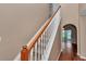 Staircase with carpeted steps and a white railing, leading to the upper level of the house at 4602 Se 28Th St, Ocala, FL 34480