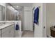 Bathroom featuring a walk-in shower, double sinks, and modern fixtures at 4661 Sw Gardenia Ct, Dunnellon, FL 34431