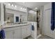 Bathroom featuring a walk-in shower, double sinks, and modern fixtures at 4661 Sw Gardenia Ct, Dunnellon, FL 34431