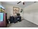 Bedroom with ceiling fan, TV, desk and chair at 4661 Sw Gardenia Ct, Dunnellon, FL 34431