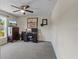Bedroom with ceiling fan, TV, desk and chair at 4661 Sw Gardenia Ct, Dunnellon, FL 34431