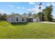Charming single-story home with well-manicured lawn and an American flag waving at 4661 Sw Gardenia Ct, Dunnellon, FL 34431