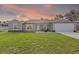 Charming single-story home with a well-maintained lawn, pretty landscaping, and modern design at 4661 Sw Gardenia Ct, Dunnellon, FL 34431