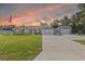 Charming single-story home features a well-maintained lawn, large driveway and detached two-car garage at 4661 Sw Gardenia Ct, Dunnellon, FL 34431