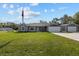 Charming single-story home boasts a manicured lawn, long driveway and detached two-car garage at 4661 Sw Gardenia Ct, Dunnellon, FL 34431