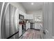 Modern kitchen equipped with stainless steel appliances, white cabinets, and granite countertops at 4661 Sw Gardenia Ct, Dunnellon, FL 34431