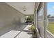 Enjoy this screened porch featuring a ceiling fan and views of the backyard at 4661 Sw Gardenia Ct, Dunnellon, FL 34431