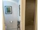 An ensuite bathroom has a walk-in shower, separate water closet, and decorative art at 530 Casteel Ave, The Villages, FL 32163