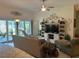 Inviting living room featuring a comfortable seating arrangement and sliding glass doors to the patio at 530 Casteel Ave, The Villages, FL 32163