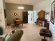 Open office space featuring stylish decor, wood furniture, and tiled floors at 530 Casteel Ave, The Villages, FL 32163