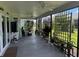 Spacious covered outdoor patio with plants and privacy, perfect for relaxation at 530 Casteel Ave, The Villages, FL 32163