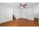 Spacious bedroom with wood-look floors, neutral walls and ceiling fan at 5740 Nw 61St St, Ocala, FL 34482