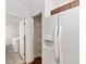 Kitchen with pantry and stainless steel appliances, including a white refrigerator at 5740 Nw 61St St, Ocala, FL 34482