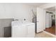 This laundry area has a washer and dryer near the kitchen at 5740 Nw 61St St, Ocala, FL 34482