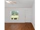 Cozy living room with hardwood floors, natural light, and a welcoming atmosphere at 5740 Nw 61St St, Ocala, FL 34482