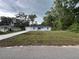 Charming single-story home with light blue exterior, well-maintained lawn, and paved driveway at 6422 Nw 62Nd Pl, Ocala, FL 34482