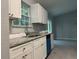 Kitchen featuring granite counters, stainless steel sink, and white cabinets, with window at 6422 Nw 62Nd Pl, Ocala, FL 34482