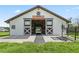 Spacious equestrian barn featuring large sliding doors, ample lighting, and quality construction for horse enthusiasts at 7041 Ne 22Nd Court Rd, Ocala, FL 34479