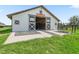 A well-maintained barn featuring a sliding door, situated near a lush grassy area at 7041 Ne 22Nd Court Rd, Ocala, FL 34479