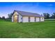 Spacious white barn with sliding doors and ample grazing area at 7041 Ne 22Nd Court Rd, Ocala, FL 34479
