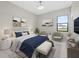 Cozy bedroom with a large window, stylish furniture, and coordinated decor, perfect for relaxing at 7041 Ne 22Nd Court Rd, Ocala, FL 34479