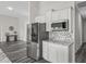 Kitchen featuring stainless steel appliances, white cabinets, and stone countertops at 7041 Ne 22Nd Court Rd, Ocala, FL 34479