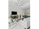 Comfortable living room with a large entertainment center, neutral walls and furniture at 7041 Ne 22Nd Court Rd, Ocala, FL 34479