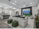 Bright living room with a large window showcasing the barn with black fencing at 7041 Ne 22Nd Court Rd, Ocala, FL 34479