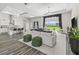 Open-concept living space with a large window offering views of the lush, green pasture at 7041 Ne 22Nd Court Rd, Ocala, FL 34479