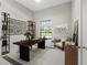 Bright home office features large desk, shelving, and a view to the outdoors at 7041 Ne 22Nd Court Rd, Ocala, FL 34479
