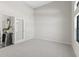 Bright and spacious room with neutral carpet ready for your personal design and decor at 7041 Ne 22Nd Court Rd, Ocala, FL 34479