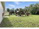 Spacious backyard featuring a charming gazebo with seating and a fun-filled playset for outdoor enjoyment at 710 Barwick St, Wildwood, FL 34785