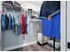 Organized walk-in closet with shelving, hanging rods, and ample storage space at 710 Barwick St, Wildwood, FL 34785