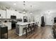 Bright kitchen with stainless steel appliances, a breakfast bar, and plenty of cabinet space at 710 Barwick St, Wildwood, FL 34785