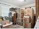 Organized storage area with cardboard boxes and shelving units at 710 Barwick St, Wildwood, FL 34785