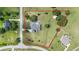 Aerial view of the property showcasing the home, pool, expansive lot, and surrounding landscape at 7220 Nw 83 Ter, Ocala, FL 34482
