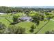 Sprawling backyard featuring a screened pool, storage shed and mature trees enclosed with black country style fencing at 7220 Nw 83 Ter, Ocala, FL 34482