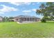 Beautiful backyard with a screened pool, perfect for outdoor entertaining at 7220 Nw 83 Ter, Ocala, FL 34482