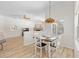 Dining room featuring wainscoting, hanging light fixture, and bright lighting at 7220 Nw 83 Ter, Ocala, FL 34482