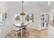 Dining room featuring wainscoting, hanging light fixture, and sliding glass doors at 7220 Nw 83 Ter, Ocala, FL 34482
