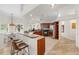 Bright kitchen boasts wood cabinets, stainless appliances, a breakfast bar with seating and views to the outside at 7220 Nw 83 Ter, Ocala, FL 34482