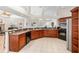Open concept kitchen featuring cherry cabinets, and stainless steel appliances at 7220 Nw 83 Ter, Ocala, FL 34482