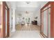 Bright living room boasts high ceilings, wood floors, and backyard views at 7220 Nw 83 Ter, Ocala, FL 34482