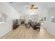 Spacious living room with fireplace, neutral sectional, with sliding door to backyard at 7220 Nw 83 Ter, Ocala, FL 34482