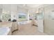 Bright bathroom featuring a garden tub, walk-in shower, and large windows with a view at 7220 Nw 83 Ter, Ocala, FL 34482